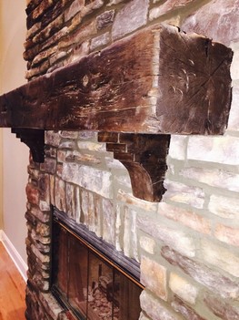 Wolf Creek Southern Ledge stone fireplace with distressed corbels and mantle Roswell, GA